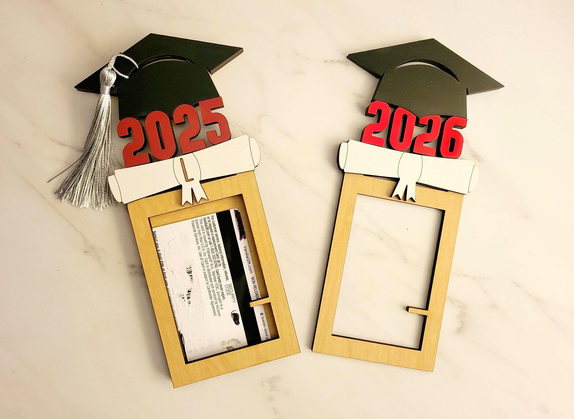 2025, 2026 gift card holder.  A wood square box with a black graduation cap on the top with the year 2025 and a diploma and tassel.